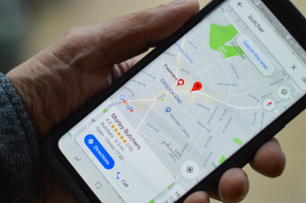 A person looking into nearby shops on Google maps